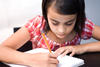 Young girl writing Young girl writing