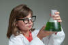 Girl holding flask in science laboratory Girl holding flask in science laboratory