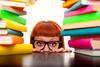 Young girl surrounded by books Young girl surrounded by books