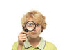 Boy looking through magnifying glass Boy looking through magnifying glass