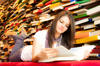 Young girl reading in library Young girl reading in library