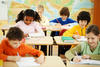 students writing in a classroom students writing in a classroom