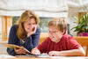 Mother and son reading (homeschooling) Mother and son reading (homeschooling)
