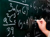 Writing math equations on the chalkboard Writing math equations on the chalkboard