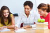 Teacher writing with students Teacher writing with students