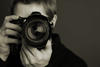 Person holding a camera Person holding a camera