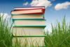 stack of books in the grass stack of books in the grass