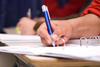 a hand writing on paper a hand writing on paper