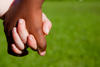 black hand holding a white hand black hand holding a white hand