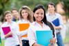 Girl in front of other classmates Girl in front of other classmates