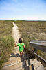 girl walking down a path girl walking down a path