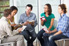 adults at a book club meeting adults at a book club meeting